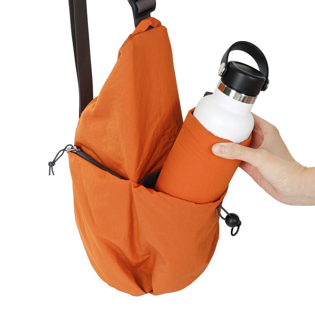 REMI - Anywhere Sling Bag - HELLOLULU LIVING SOLUTIONS. Burnt Orange